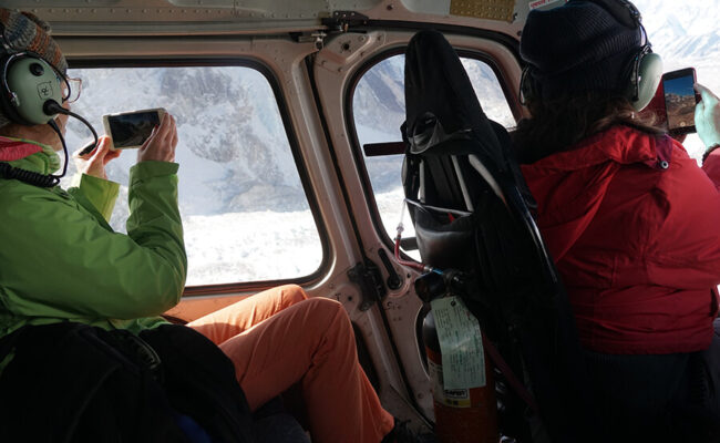 Everest base camp helicopter tour tourist taking picture